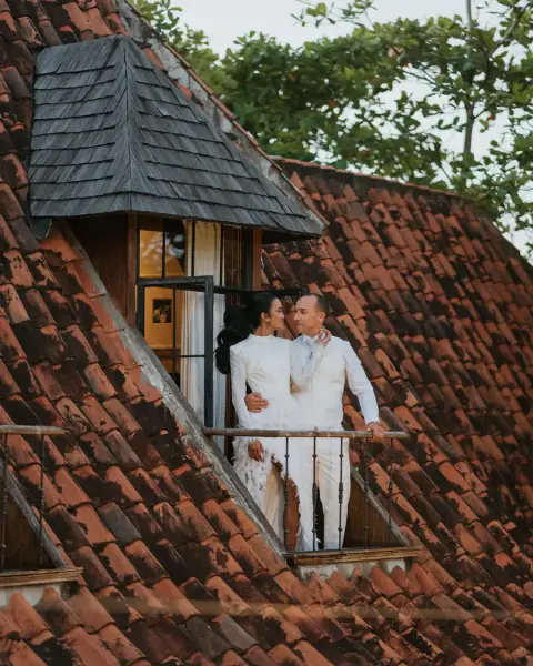 A couple on the balcony of their Bali villa