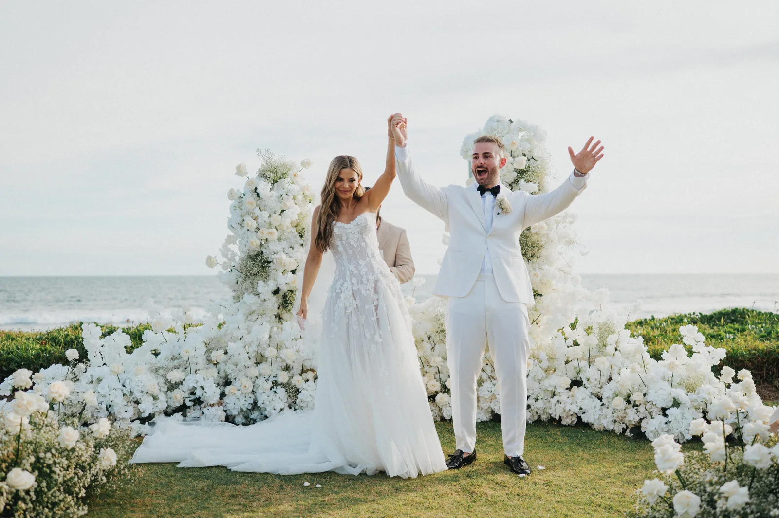 A couple celebrating at the end of the aisle at Phalosa Villa